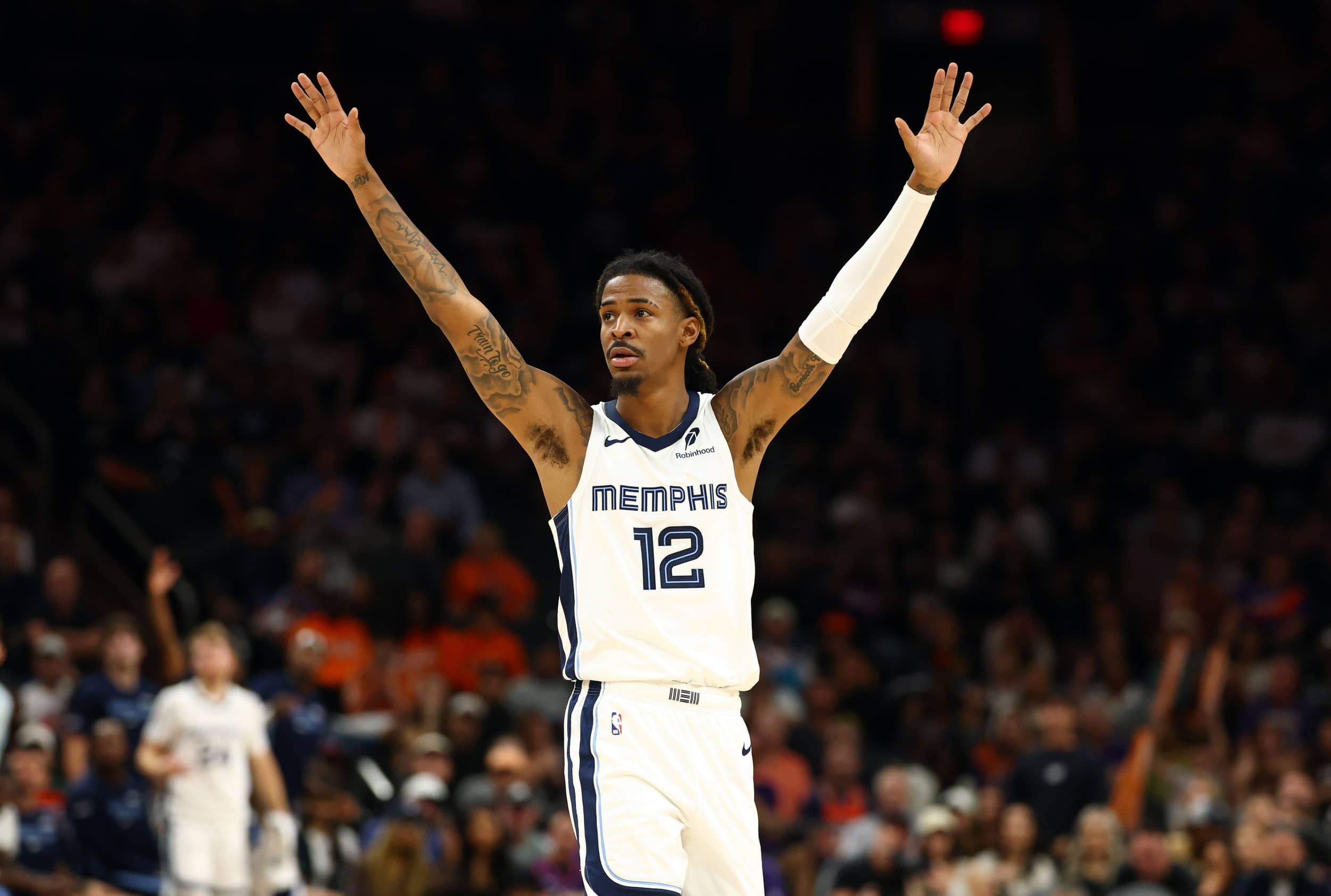 Oct 29, 2025; Phoenix, Arizona, USA; Memphis Grizzlies guard Ja Morant (12) reacts against the Phoenix Suns during the second half at the Mortgage Matchup Center. Mandatory Credit: Mark J. Rebilas-Imagn Images
