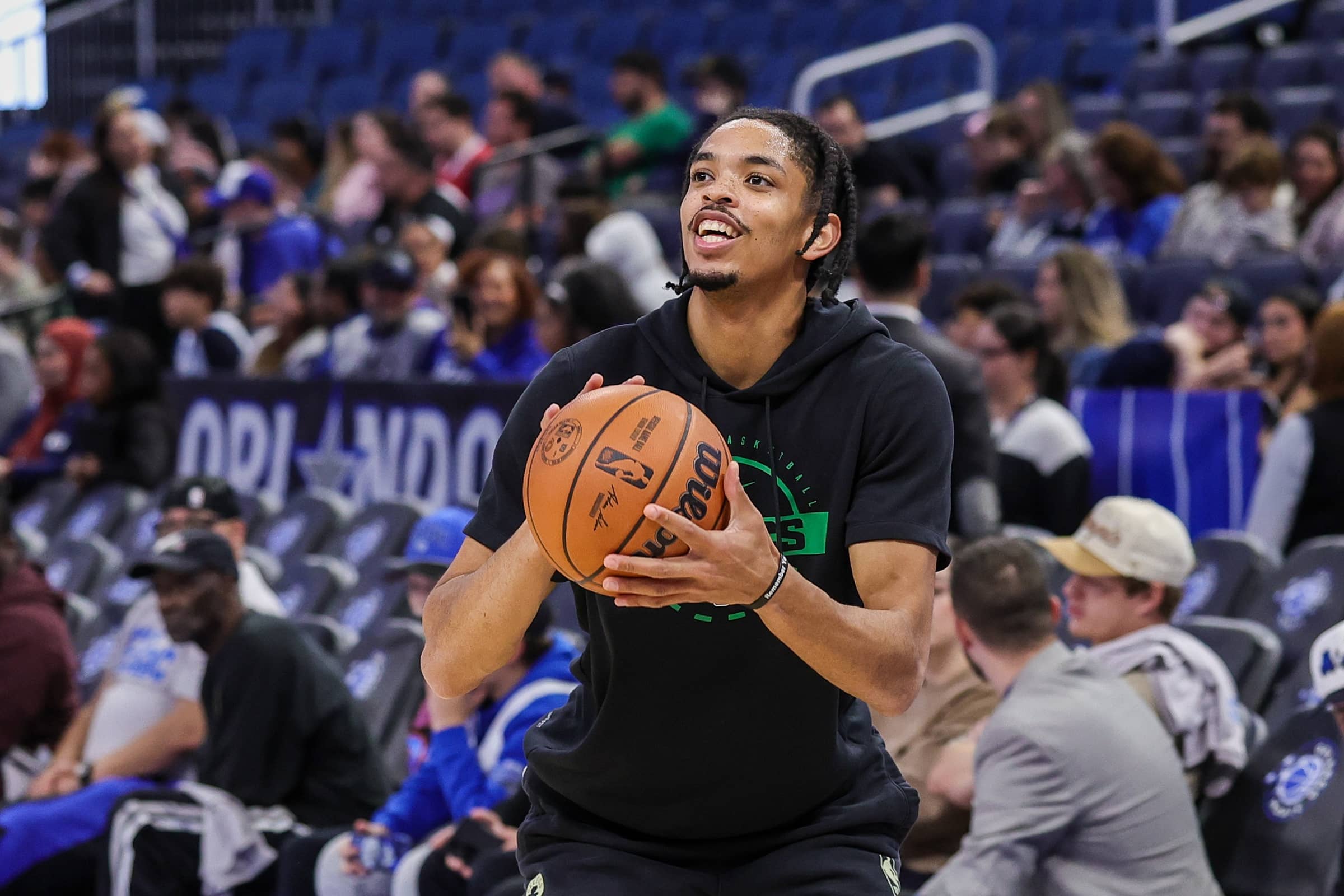 Boston Celtics forward Josh Minott (8) warms up before the game against the Orlando Magic at Kia Center.