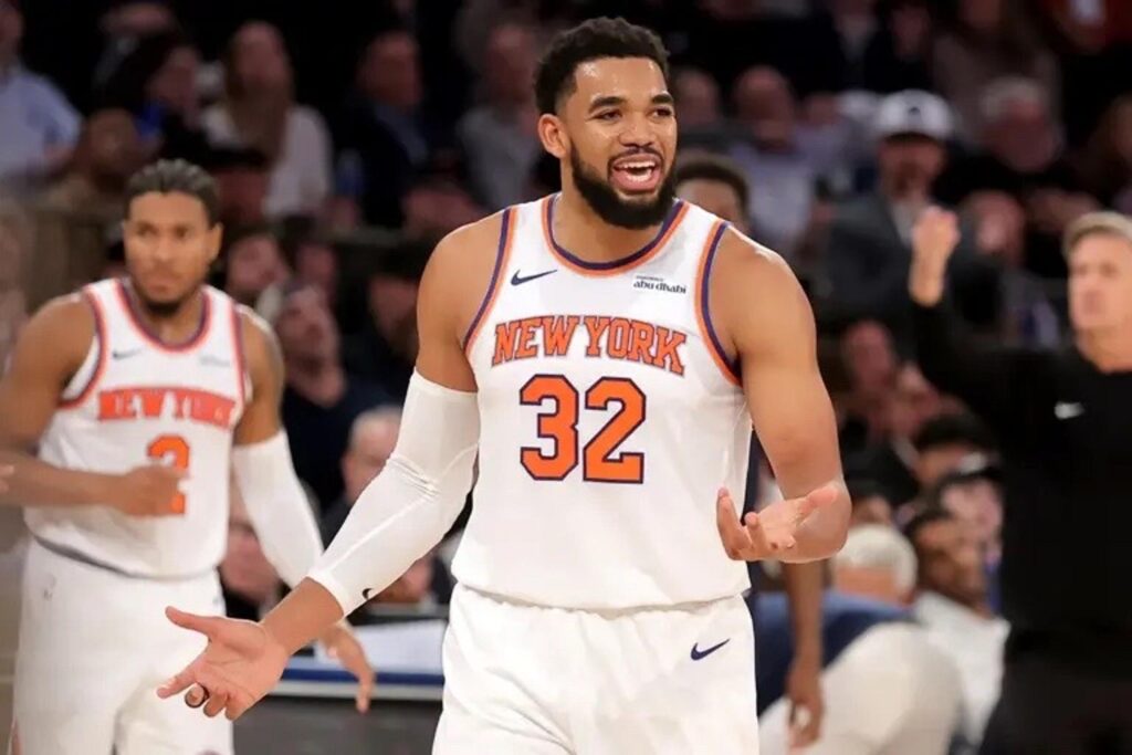 Nov 5, 2025; New York, New York, USA; New York Knicks center Karl-Anthony Towns (32) reacts after being called for an offensive foul during the third quarter against the Minnesota Timberwolves at Square Garden. Mandatory Credit: Brad Penner-Imagn Images