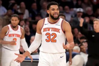 Nov 5, 2025; New York, New York, USA; New York Knicks center Karl-Anthony Towns (32) reacts after being called for an offensive foul during the third quarter against the Minnesota Timberwolves at Square Garden. Mandatory Credit: Brad Penner-Imagn Images