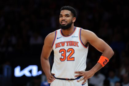 Miami, Florida, USA; New York Knicks center Karl-Anthony Towns (32) looks on against the Miami Heat during the first quarter at Kaseya Center. Mandatory Credit: Sam Navarro-Imagn Images