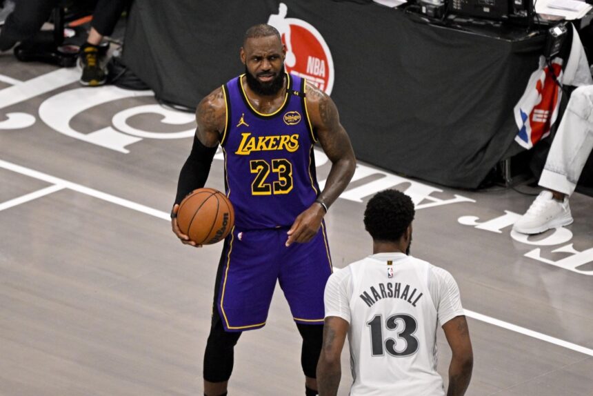 Apr 9, 2025; Dallas, Texas, USA; Los Angeles Lakers forward LeBron James (23) and Dallas Mavericks forward Naji Marshall (13) in action during the game between the Dallas Mavericks and the Los Angeles Lakers at American Airlines Center.