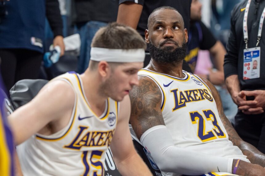Apr 27, 2025; Minneapolis, Minnesota, USA; Los Angeles Lakers forward LeBron James (23) reacts to a replay that confirms he fouled Minnesota Timberwolves guard Anthony Edwards (5) in the fourth quarter during game four of first round for the 2025 NBA Playoffs at Target Center. Mandatory Credit: Matt Blewett-Imagn Images