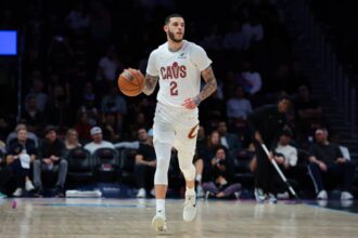 Cleveland Cavaliers guard Lonzo Ball (2) dribbles the basketball against the Miami Heat during the first quarter at Kaseya Center.