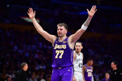 Los Angeles, California, USA; Los Angeles Lakers guard Luka Doncic (77) reacts after scoring a basket against the San Antonio Spurs during the first half at Crypto.com Arena. Mandatory Credit: Gary A. Vasquez-Imagn Images