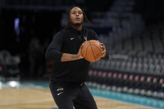 Milwaukee Bucks center Myles Turner (3) shoots during pregame warm ups against the Charlotte Hornets at Spectrum Center. Mandatory Credit: Jim Dedmon-Imagn Images