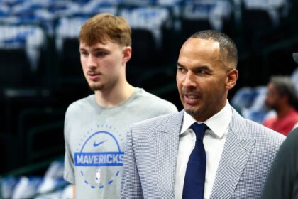Dallas Mavericks general manager Nico Harrison and Dallas Mavericks forward Cooper Flagg (32) before the game against the San Antonio Spurs at American Airlines Center.