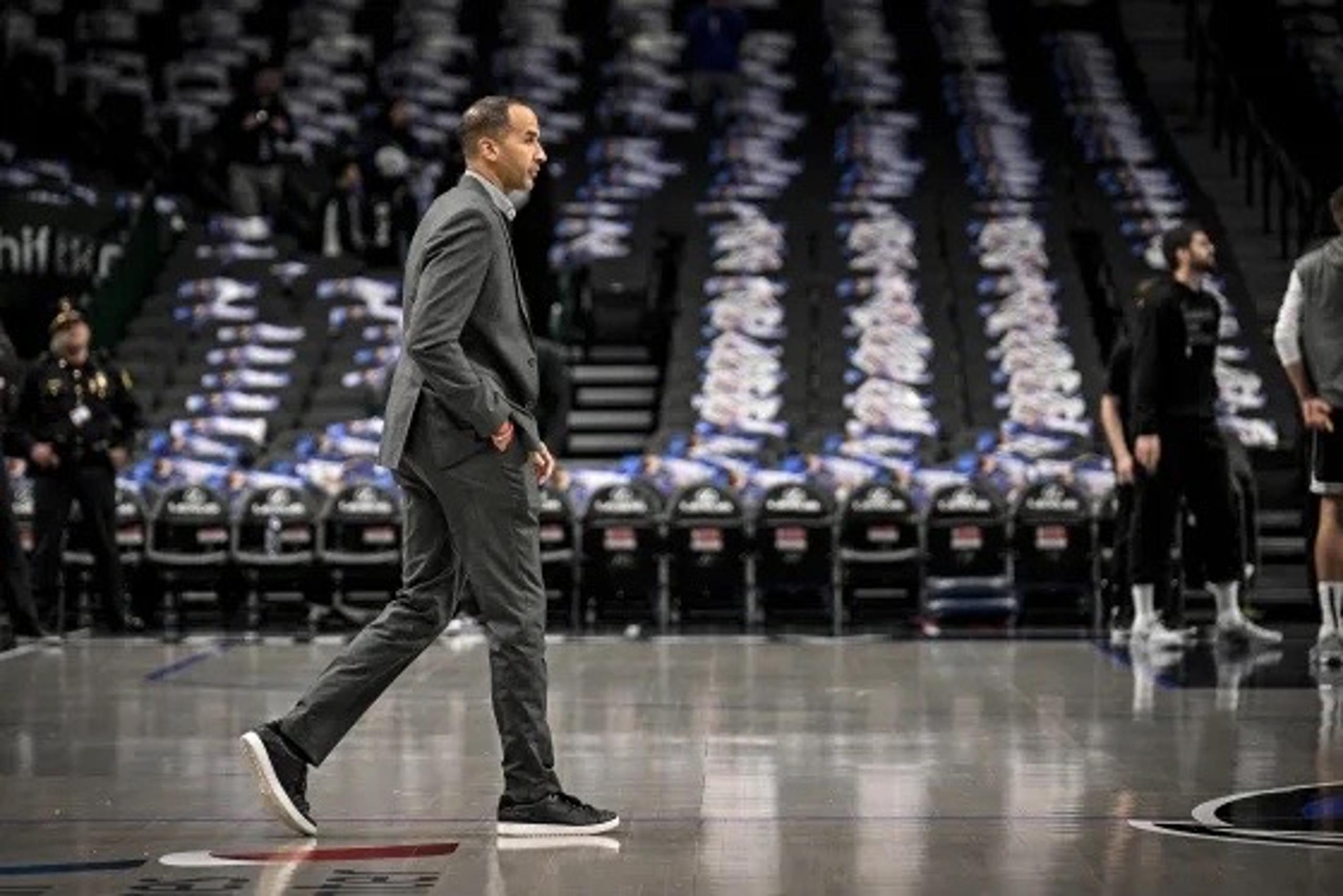 Feb 10, 2025; Dallas, Texas, USA; Dallas Mavericks general manager Nico Harrison walks on to the court before the game between the Dallas and the Sacramento Kings at the American Airlines Center. Mandatory Credit: Jerome Miron-Imagn Images