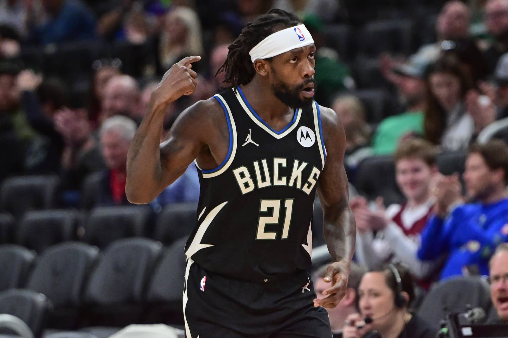 Milwaukee Bucks guard Patrick Beverley (21) reacts after scoring a basket in the third quarter against the Boston Celtics at Fiserv Forum.