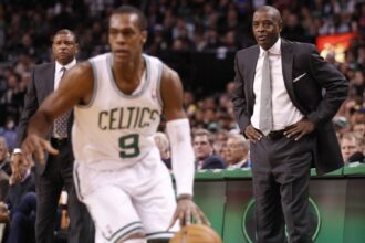 Atlanta Hawks head coach Larry Drew (right) and Boston Celtics head coach Doc Rivers (left) watch as Celtics point guard Rajon Rondo (9) drives the ball in the second half at the TD Banknorth Garden. The Celtics defeated the Atlanta Hawks 88-86 in overtime.