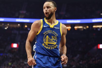 Golden State Warriors guard Stephen Curry (30) reacts after scoring against the Portland Trail Blazers in the first half at Moda Center.