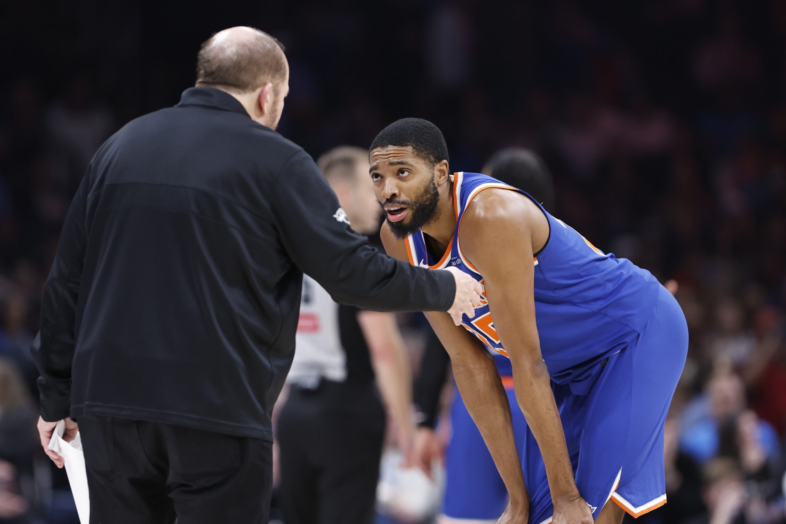 Jan 3, 2025; Oklahoma City, Oklahoma, USA; New York Knicks forward Mikal Bridges (25) talks with head coach Tom Thibodeau during a break in play against the Oklahoma City Thunder during the second quarter at Paycom Center. Mandatory Credit: Alonzo Adams-Imagn Images
