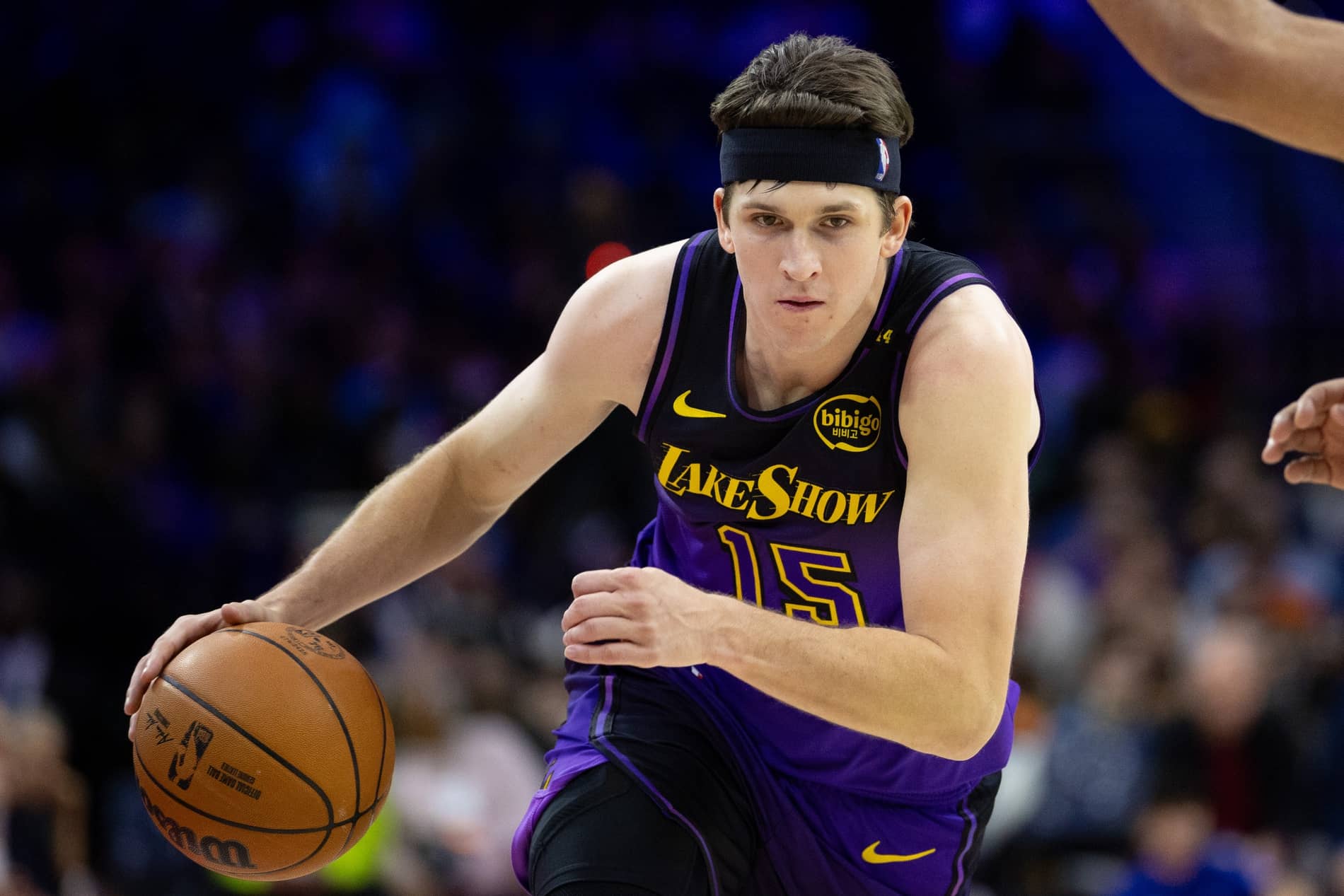 Jan 28, 2025; Philadelphia, Pennsylvania, USA; Los Angeles Lakers guard Austin Reaves (15) dribbles the ball against the Philadelphia 76ers during the second quarter at Wells Fargo Center. Mandatory Credit: Bill Streicher-Imagn Images