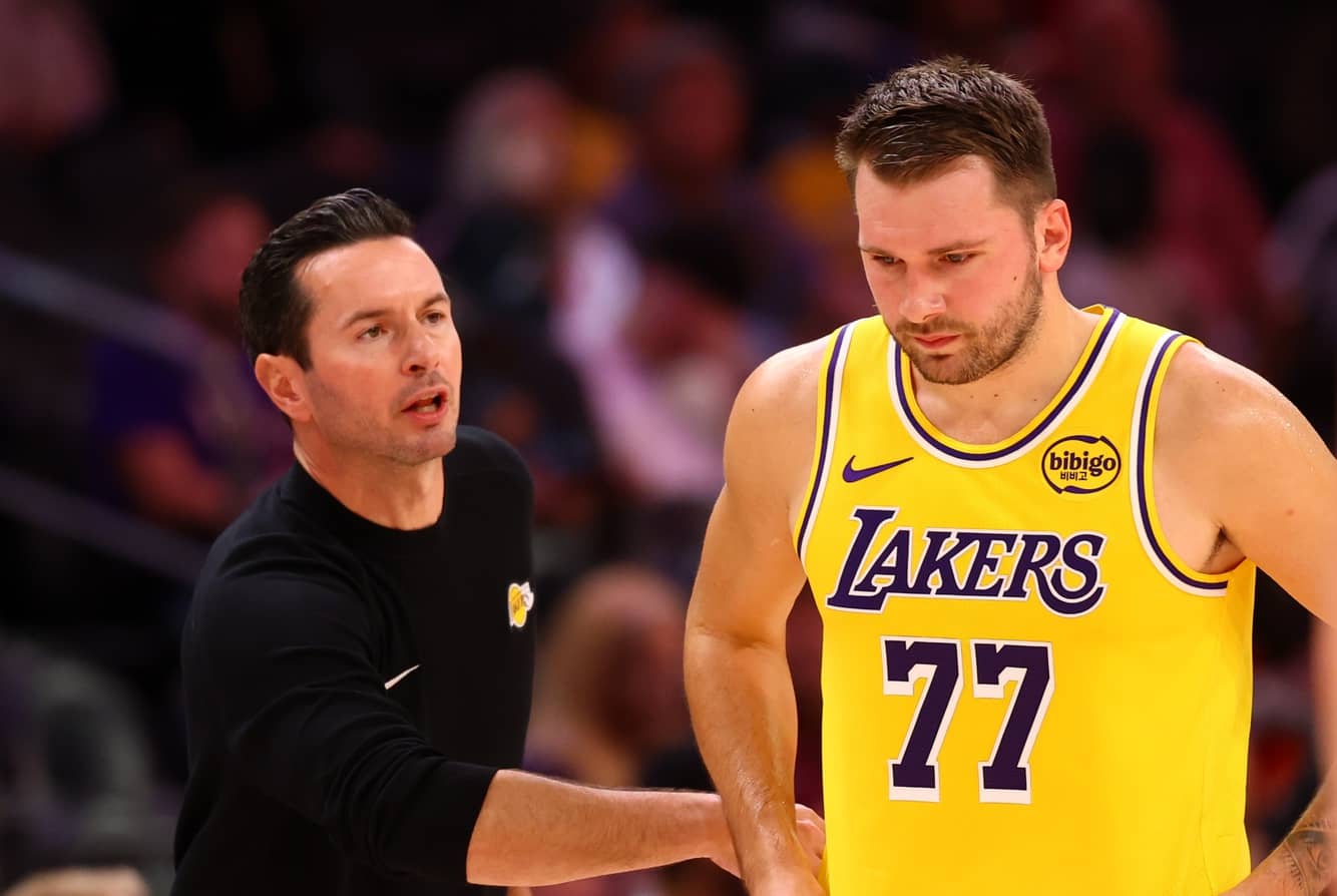 Los Angeles Lakers guard Luka Doncic (77) with head coach JJ Redick against the Phoenix Suns during an NBA preseason game at Mortgage Matchup Center.