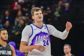Salt Lake City, Utah, USA; Utah Jazz center Walker Kessler (24) smiles after making a great play during the first half against the Portland Trail Blazers at Delta Center. Mandatory Credit: Peter Creveling-Imagn Images
