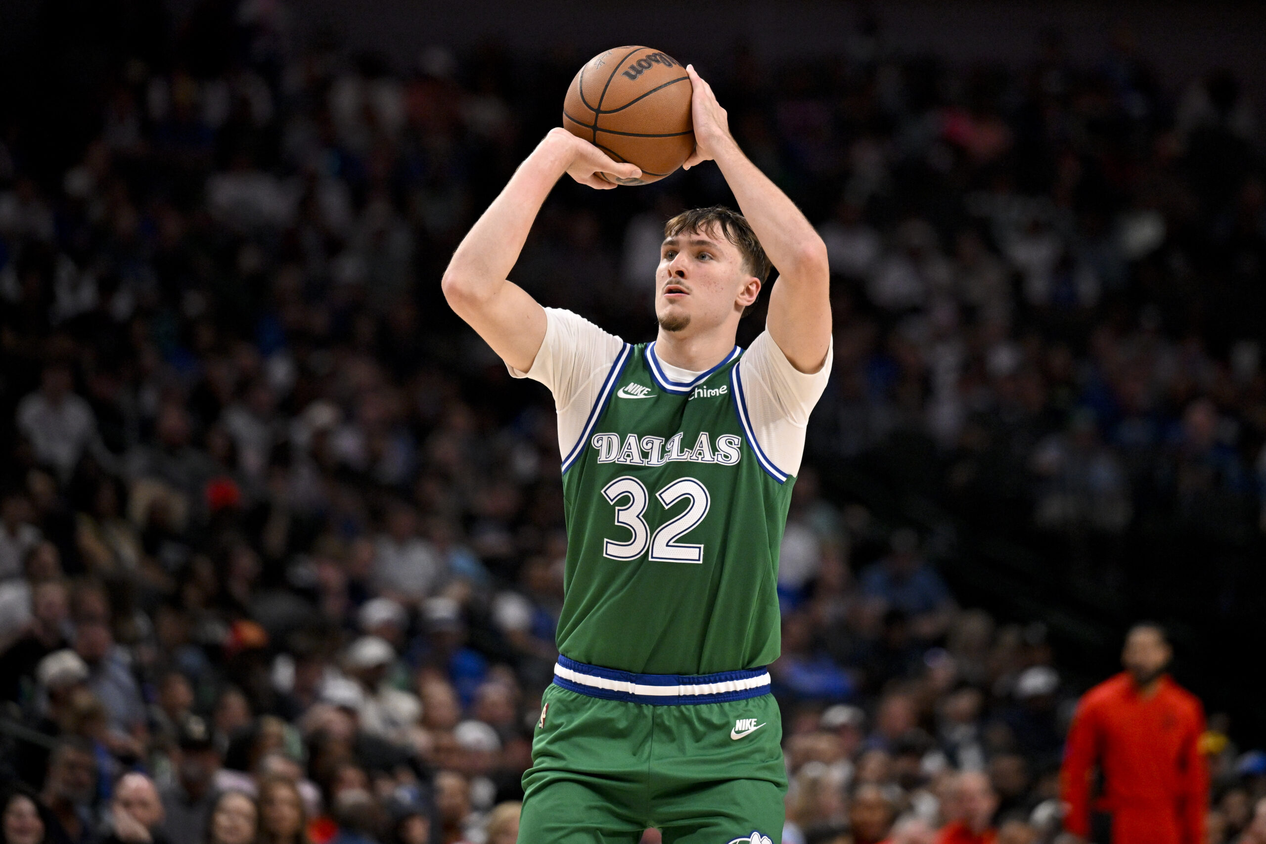 Oct 26, 2025; Dallas, Texas, USA; Dallas Mavericks forward Cooper Flagg (32) makes a three point shot against the Toronto Raptors during the second half at the American Airlines Center. Mandatory Credit: Jerome Miron-Imagn Images