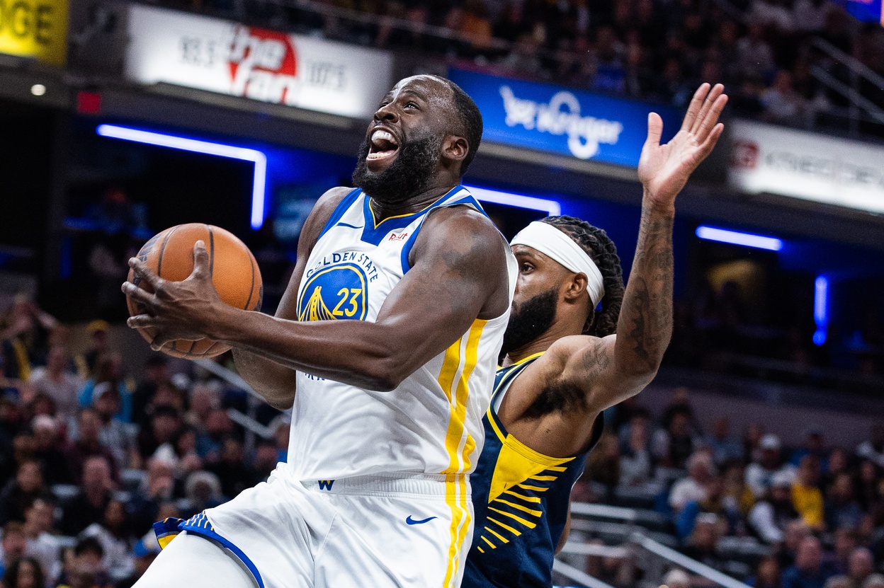 Nov 1, 2025; Indianapolis, Indiana, USA; Golden State Warriors forward Draymond Green (23) shoots the ball while Indiana Pacers forward Isaiah Jackson (22) defends in the first half at Gainbridge Fieldhouse. Mandatory Credit: Trevor Ruszkowski-Imagn Images
