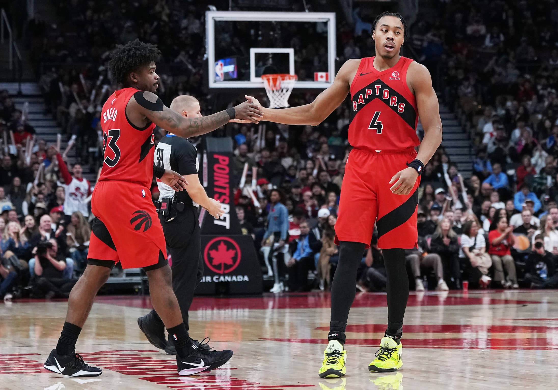 Nov 2, 2025; Toronto, Ontario, CAN; Toronto Raptors forward Scottie Barnes (4) celebrates a play with guard Jamal Shead (23) against the Memphis Grizzlies during the fourth quarter at Scotiabank Arena. Mandatory Credit: Nick Turchiaro-Imagn Images