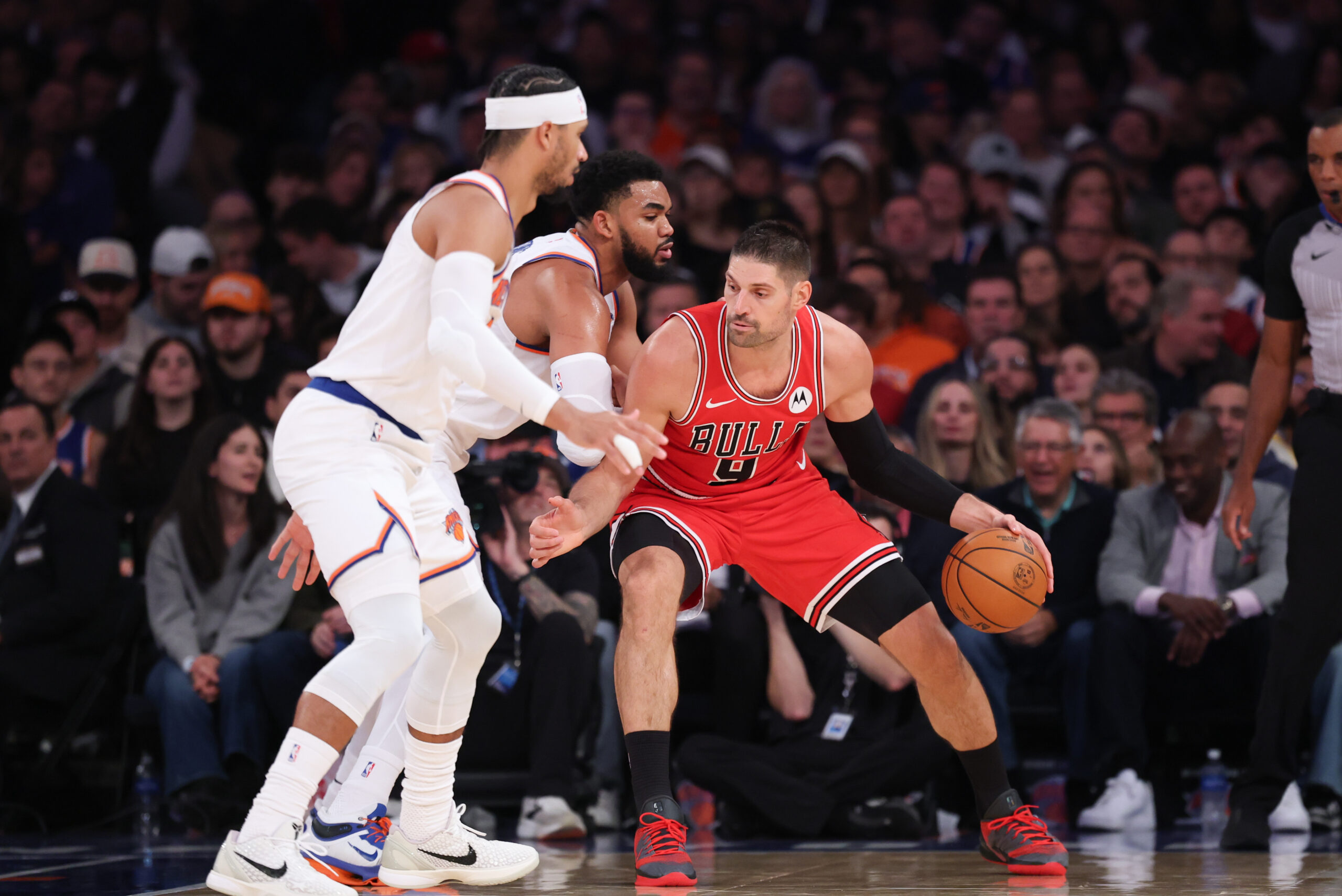Nov 2, 2025; New York, New York, USA; Chicago Bulls center Nikola Vucevic (9) dribbles against New York Knicks center Karl-Anthony Towns (32) during the second half at Madison Square Garden. Mandatory Credit: Vincent Carchietta-Imagn Images