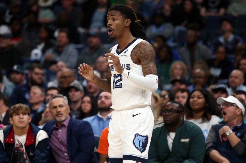 Nov 5, 2025; Memphis, Tennessee, USA; Memphis Grizzlies guard Ja Morant (12) reacts during the third quarter against the Houston Rockets at FedExForum. Mandatory Credit: Petre Thomas-Imagn Images