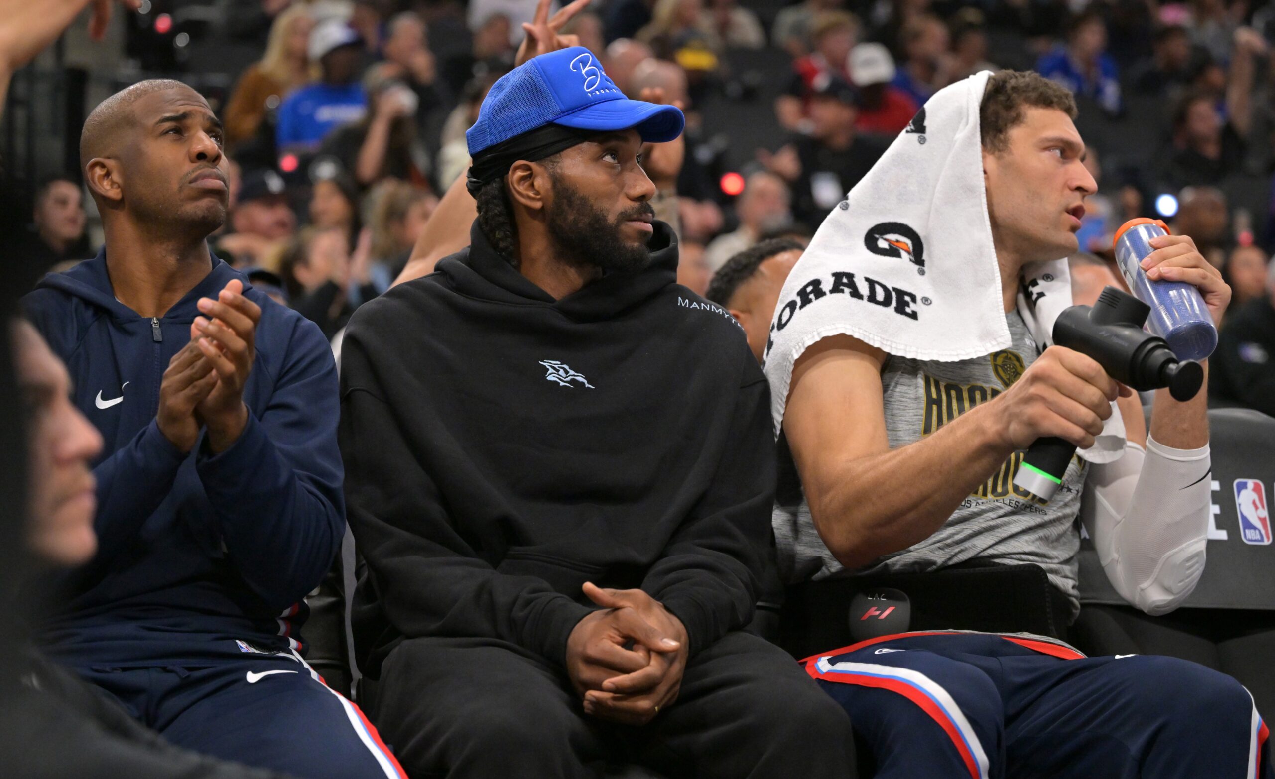 Nov 8, 2025; Inglewood, California, USA; Los Angeles Clippers guard Chris Paul (3), forward Kawhi Leonard (2) and center Brook Lopez (11) on the bench during the first half against the Phoenix Suns at Intuit Dome. Mandatory Credit: Jayne Kamin-Oncea-Imagn Images