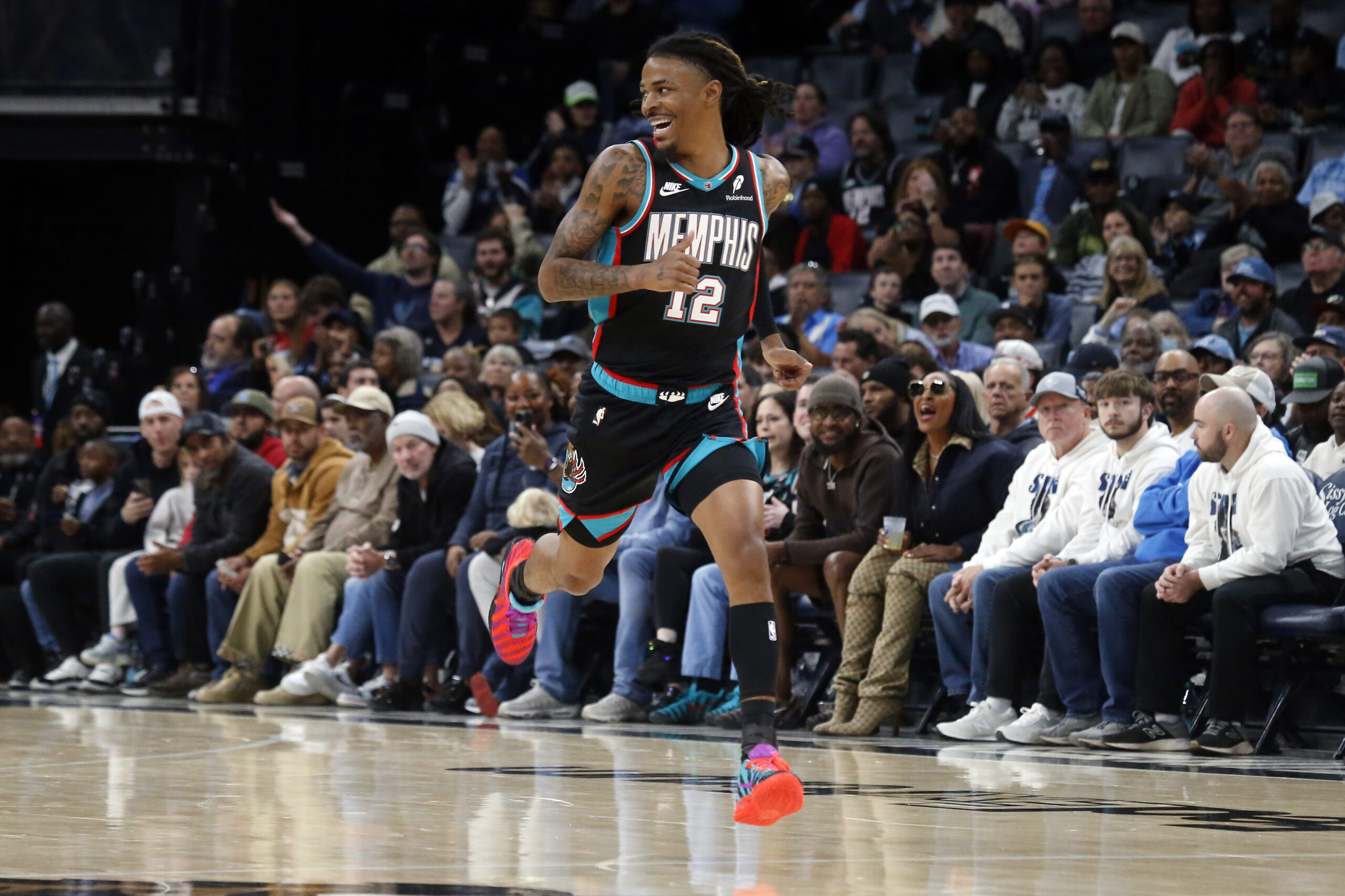 Nov 9, 2025; Memphis, Tennessee, USA; Memphis Grizzlies guard Ja Morant (12) reacts after a basket during the second quarter against the Oklahoma City Thunder at FedExForum. Mandatory Credit: Petre Thomas-Imagn Images