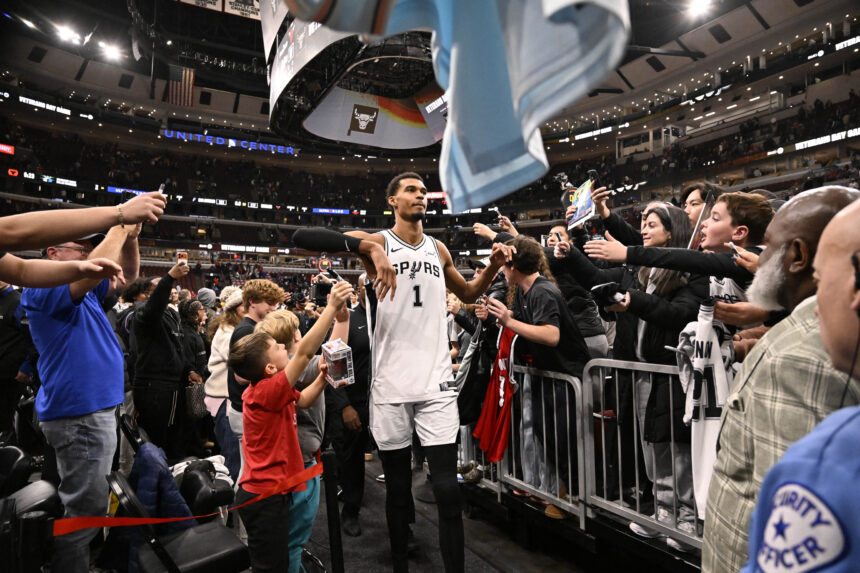 Nov 10, 2025; Chicago, Illinois, USA; San Antonio Spurs forward Victor Wembanyama (1) greets fans after the second half against the Chicago Bulls at the United Center. Mandatory Credit: Matt Marton-Imagn Images