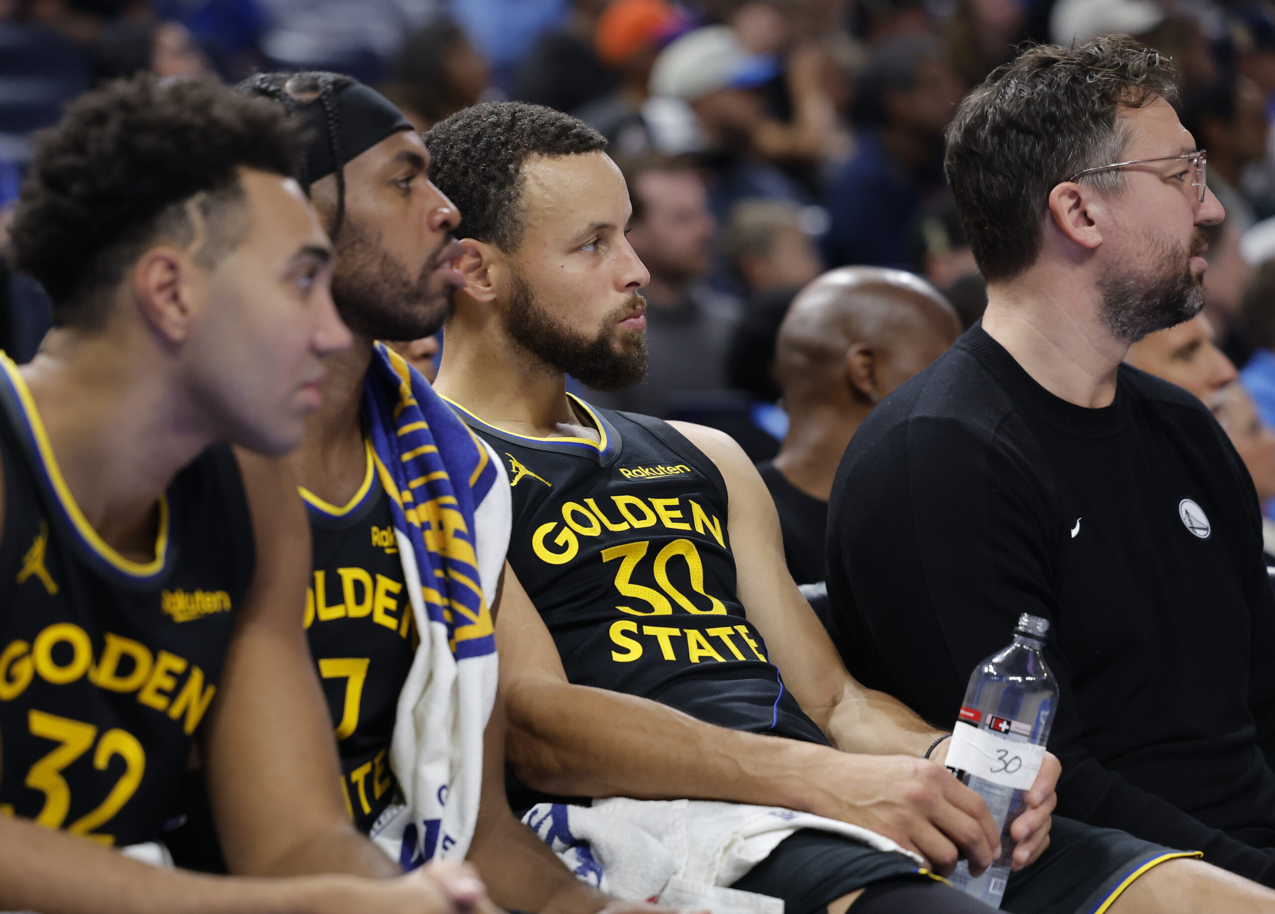 Nov 11, 2025; Oklahoma City, Oklahoma, USA; Golden State Warriors guard Stephen Curry (30) watches his team play against the Oklahoma City Thunder during the fourth quarter at Paycom Center. Mandatory Credit: Alonzo Adams-Imagn Images
