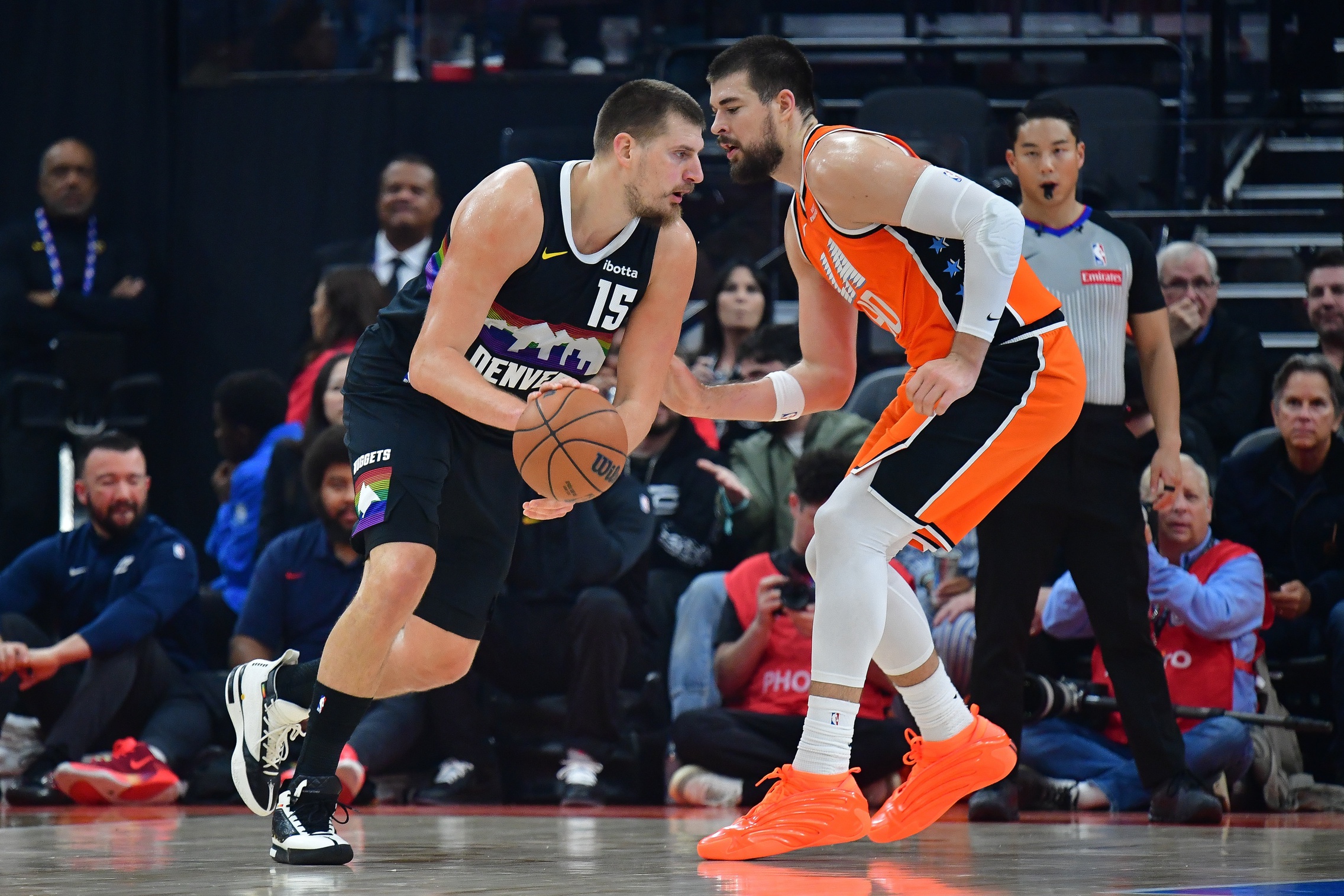 Nov 12, 2025; Inglewood, California, USA; Denver Nuggets center Nikola Jokic (15) moves the ball against Los Angeles Clippers center Ivica Zubac (40) during the first half at Intuit Dome. Mandatory Credit: Gary A. Vasquez-Imagn Images