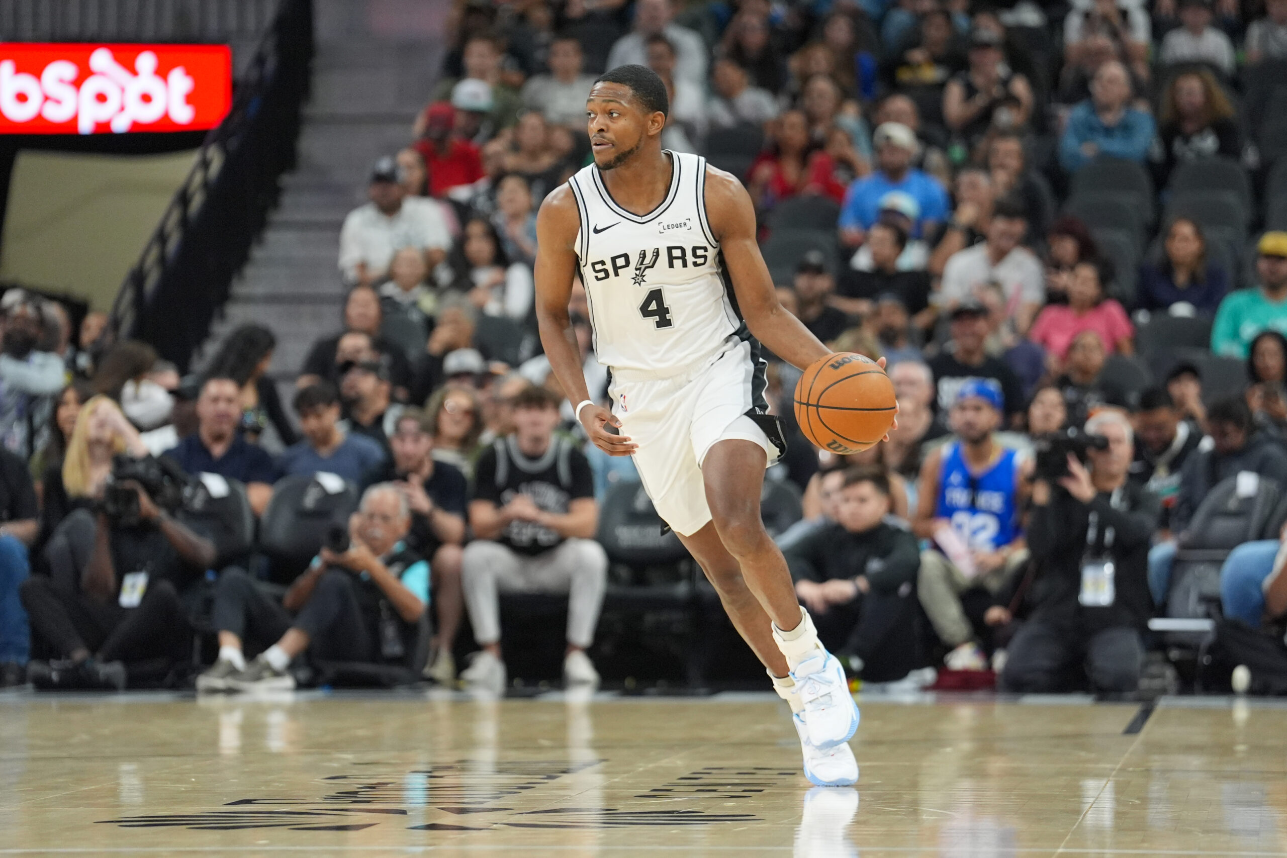 Nov 16, 2025; San Antonio, Texas, USA; San Antonio Spurs guard De'Aaron Fox (4) dribbles in the first half against the Sacramento Kings at Frost Bank Center. Mandatory Credit: Daniel Dunn-Imagn Images