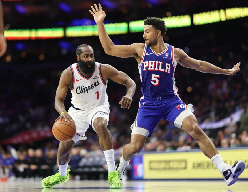 Nov 17, 2025; Philadelphia, Pennsylvania, USA; LA Clippers guard James Harden (1) drives against Philadelphia 76ers guard Quentin Grimes (5) during the third quarter at Xfinity Mobile Arena. Mandatory Credit: Bill Streicher-Imagn Images
