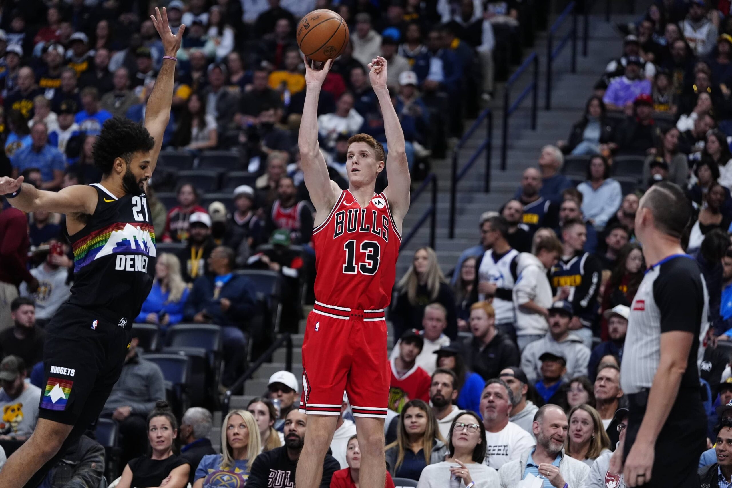 Nov 17, 2025; Denver, Colorado, USA; Chicago Bulls guard/forward Kevin Huerter (13) shoots the ball over Denver Nuggets guard Jamal Murray (27) in the first quarter at Ball Arena. Mandatory Credit: Ron Chenoy-Imagn Images