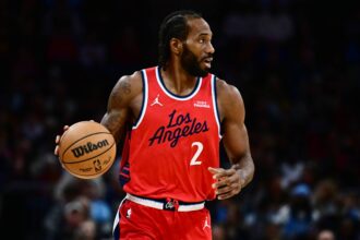 Nov 23, 2025; Cleveland, Ohio, USA; Los Angeles Clippers forward Kawhi Leonard (2) brings the ball up court against the Cleveland Cavaliers during the second half at Rocket Arena. Mandatory Credit: Ken Blaze-Imagn Images