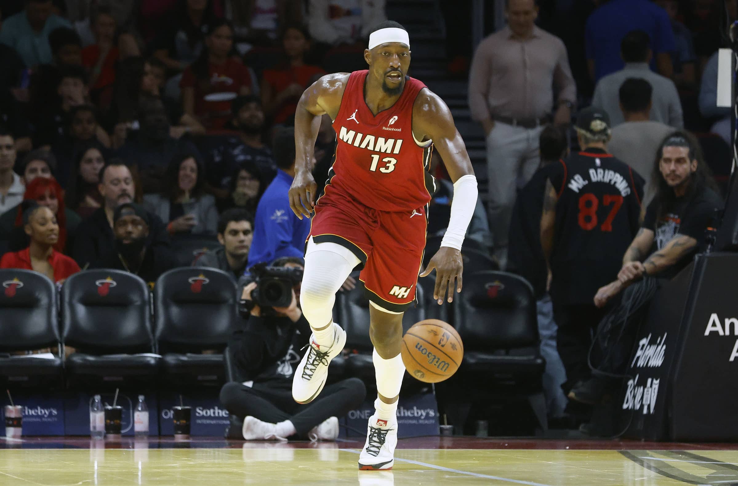 Nov 26, 2025; Miami, Florida, USA; Miami Heat center Bam Adebayo (13) brings the ball up court against the Milwaukee Bucks during the second half of an NBA Cup game at Kaseya Center. Mandatory Credit: Rhona Wise-Imagn Images