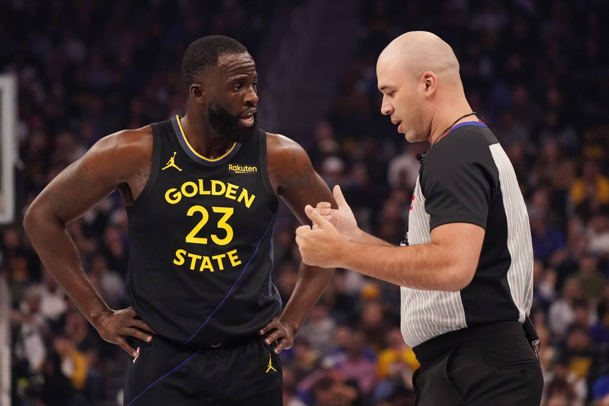 Nov 26, 2025; San Francisco, California, USA; Golden State Warriors forward Draymond Green (23) talks with the referee in the first quarter during a game against the Houston Rockets at Chase Center. Mandatory Credit: David Gonzales-Imagn Images