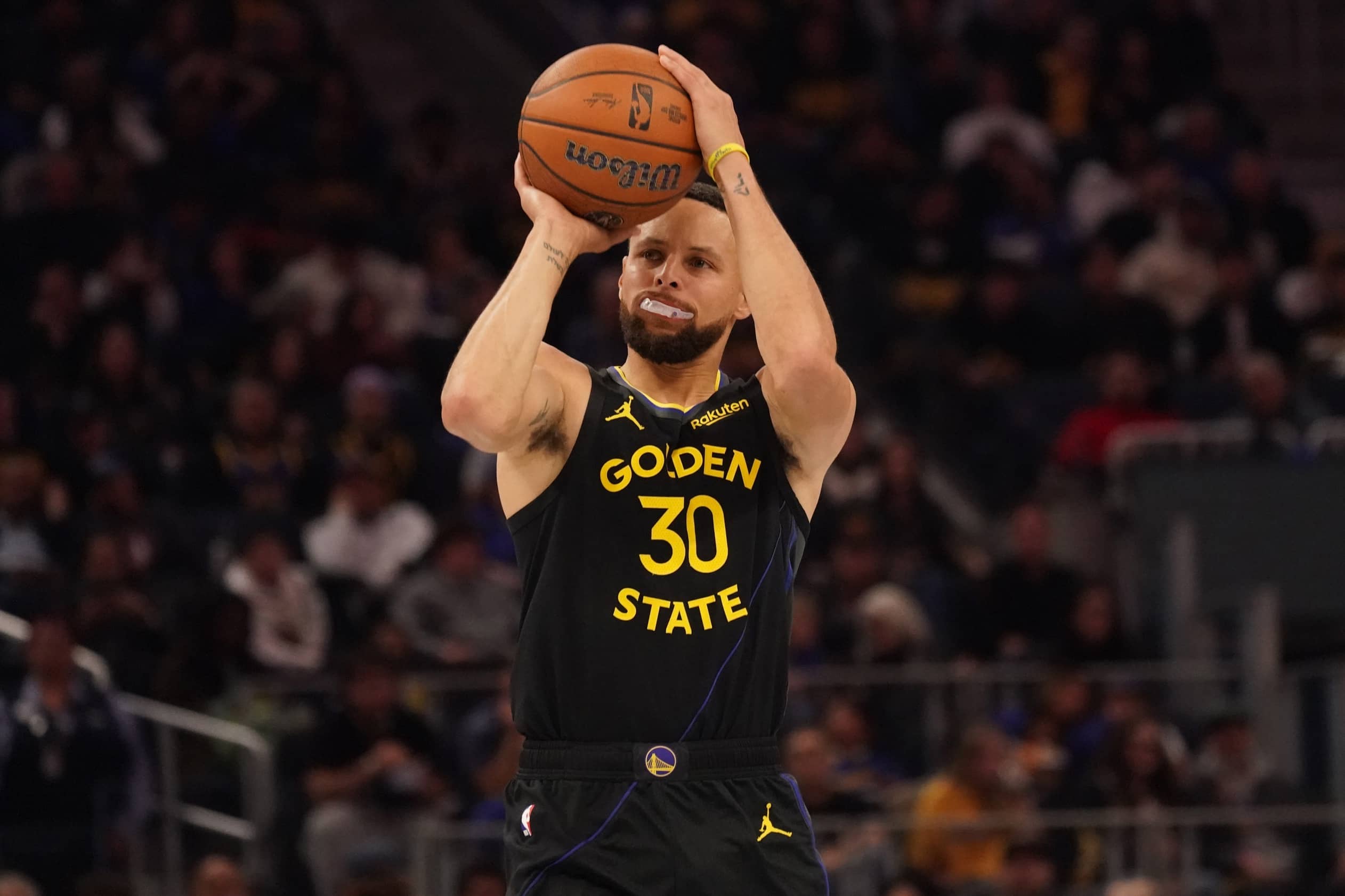 Nov 26, 2025; San Francisco, California, USA; Golden State Warriors guard Stephen Curry (30) shoots a 3-pointer against the Houston Rockets in the second quarter at Chase Center. Mandatory Credit: David Gonzales-Imagn Images