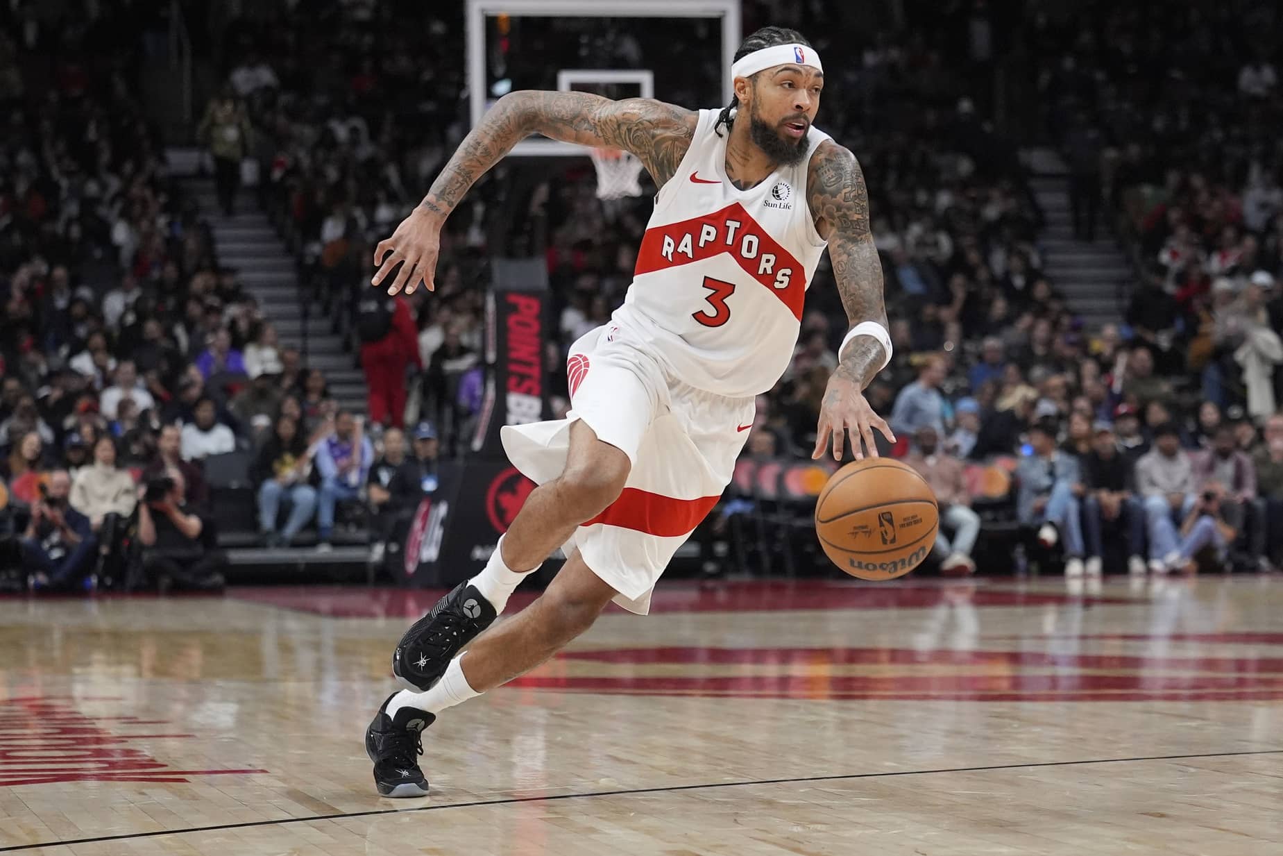 Toronto, Ontario, CAN; Toronto Raptors forward Brandon Ingram (3) dribbles the ball against the Milwaukee Bucks during the second half at Scotiabank Arena. Mandatory Credit: John E. Sokolowski-Imagn Images