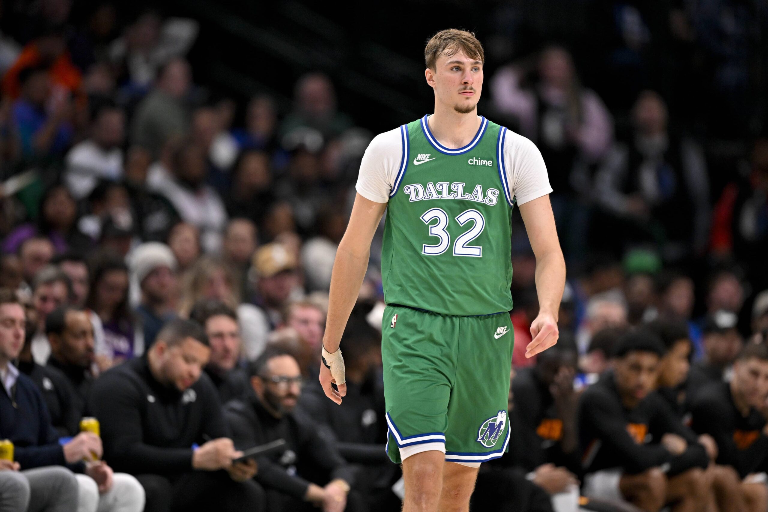Dallas, Texas, USA; Dallas Mavericks forward Cooper Flagg (32) walks back up the court during the second half against the Phoenix Suns at the American Airlines Center. Mandatory Credit: Jerome Miron-Imagn Images