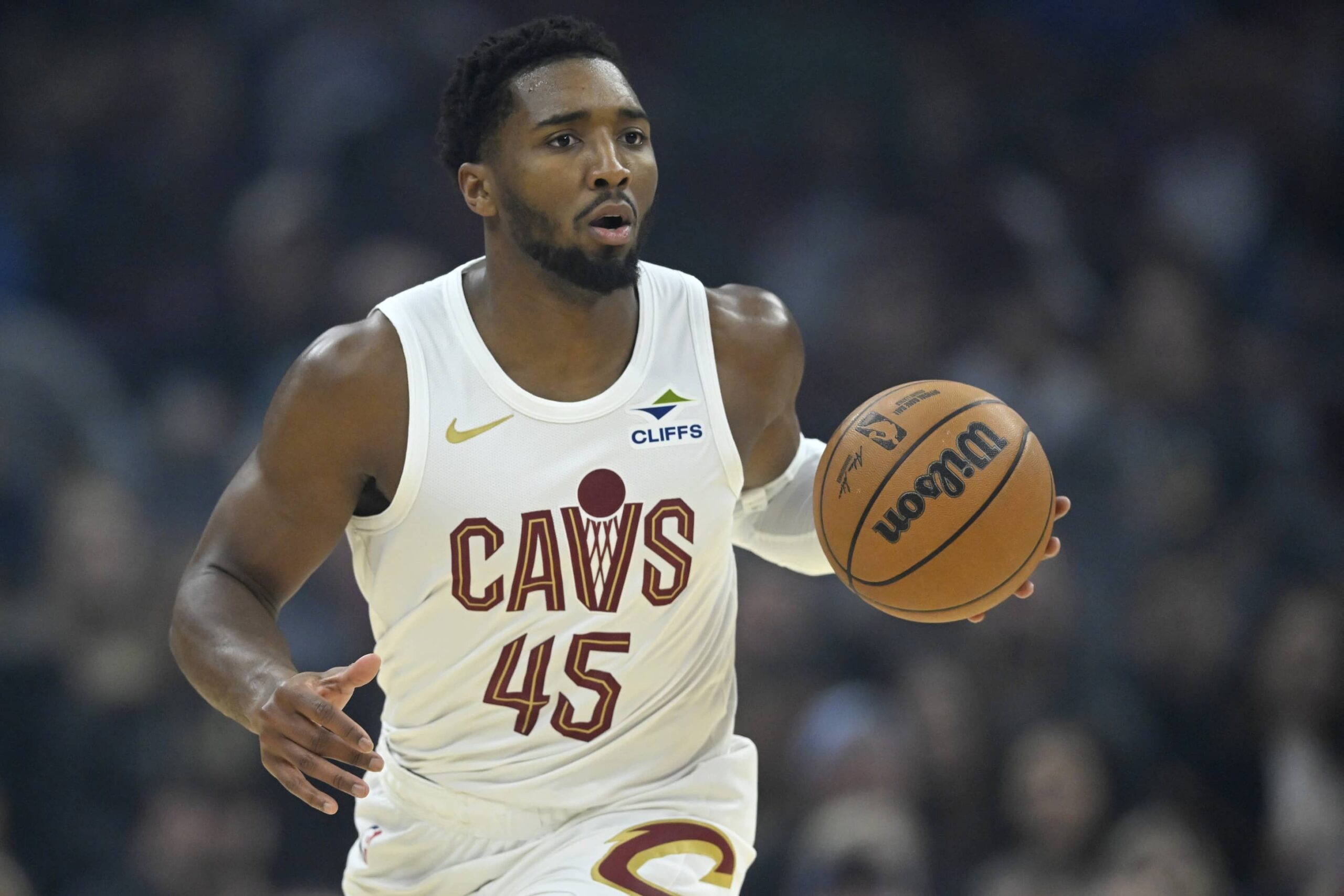 Cleveland, Ohio, USA; Cleveland Cavaliers guard Donovan Mitchell (45) brings the ball up court in the first quarter against the Toronto Raptors at Rocket Arena. Mandatory Credit: David Richard-Imagn Images