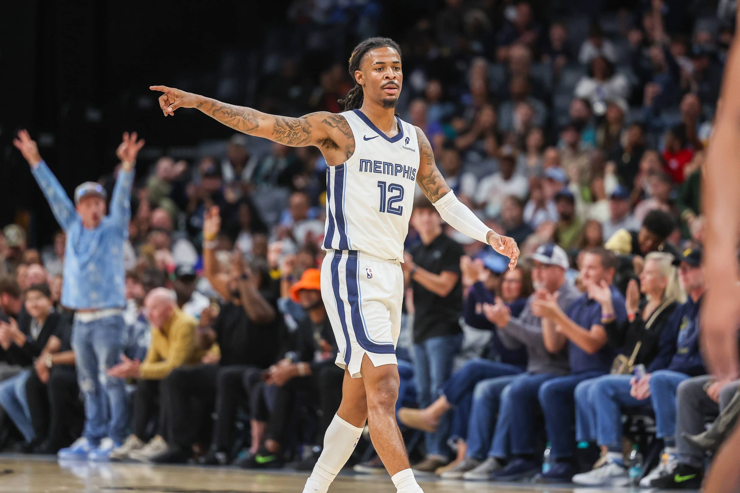 Memphis, Tennessee, USA; Memphis Grizzlies guard Ja Morant (12) reacts after a made basket against the Indiana Pacers during the first half at FedExForum. Mandatory Credit: Wesley Hale-Imagn Images