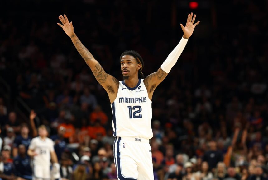 Phoenix, Arizona, USA; Memphis Grizzlies guard Ja Morant (12) reacts against the Phoenix Suns during the second half at the Mortgage Matchup Center. Mandatory Credit: Mark J. Rebilas-Imagn Images
