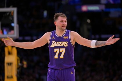 Los Angeles, California, USA; Los Angeles Lakers guard Luka Doncic (77) reacts after a foul on Dallas Mavericks forward Naji Marshall (13) in the second half at Crypto.com Arena. Mandatory Credit: Jayne Kamin-Oncea-Imagn Images