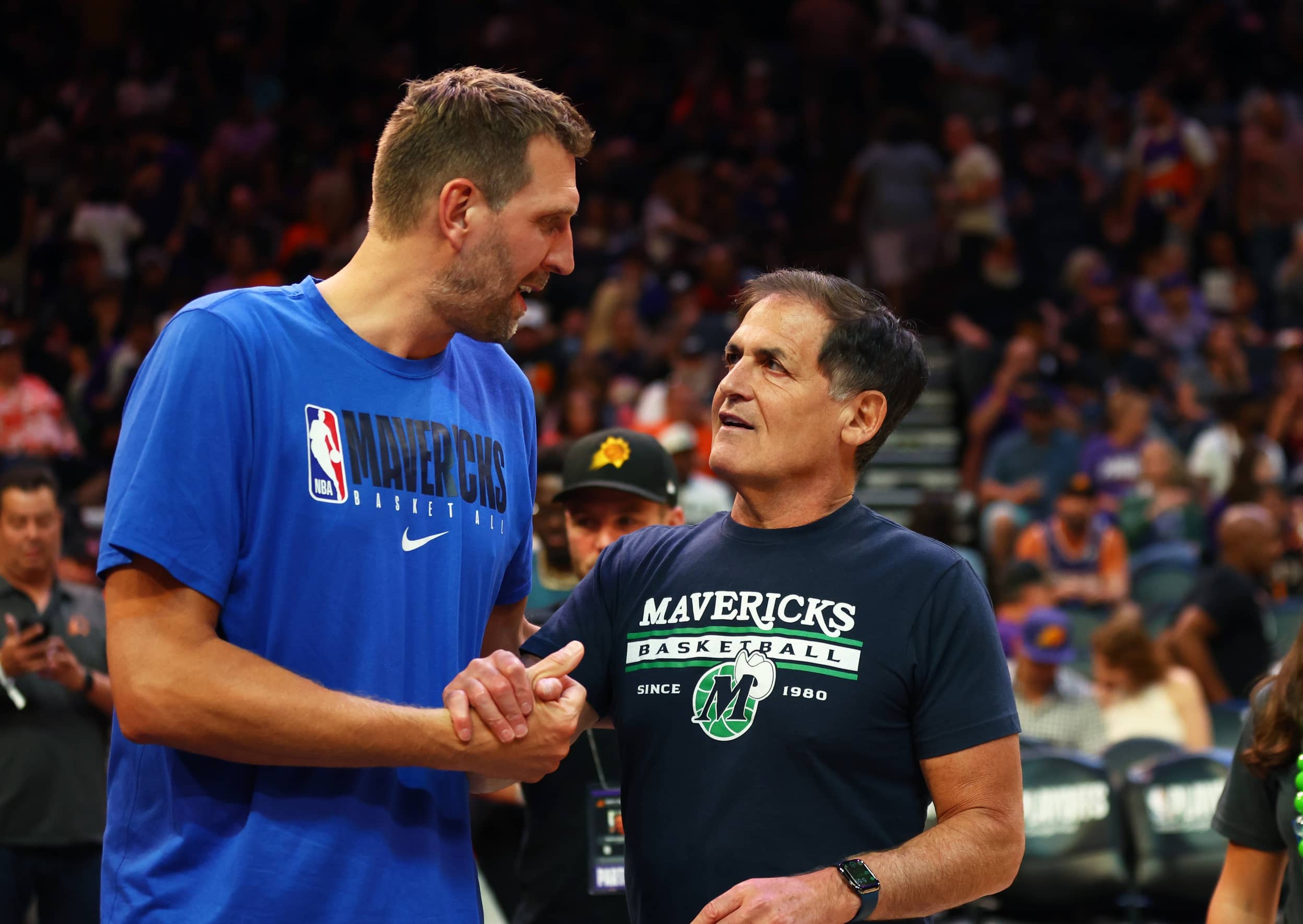 Phoenix, Arizona, USA; Dallas Mavericks owner Mark Cuban (right) with former player Dirk Nowitzki against the Phoenix Suns in Game 7 of the second round of the 2022 NBA Playoffs at Footprint Center. Mandatory Credit: Mark J. Rebilas-Imagn Images