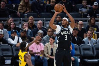 Milwaukee Bucks center/forward Myles Turner (3) shoots against Indiana Pacers forward Isaiah Jackson (22) in the first half at Gainbridge Fieldhouse. Mandatory Credit: Trevor Ruszkowski-Imagn Images