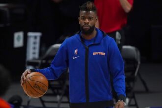 Denver, Colorado, USA; New York Knicks forward Reggie Bullock (25) prior to the game against the Denver Nuggets at Ball Arena. Mandatory Credit: Ron Chenoy-Imagn Images