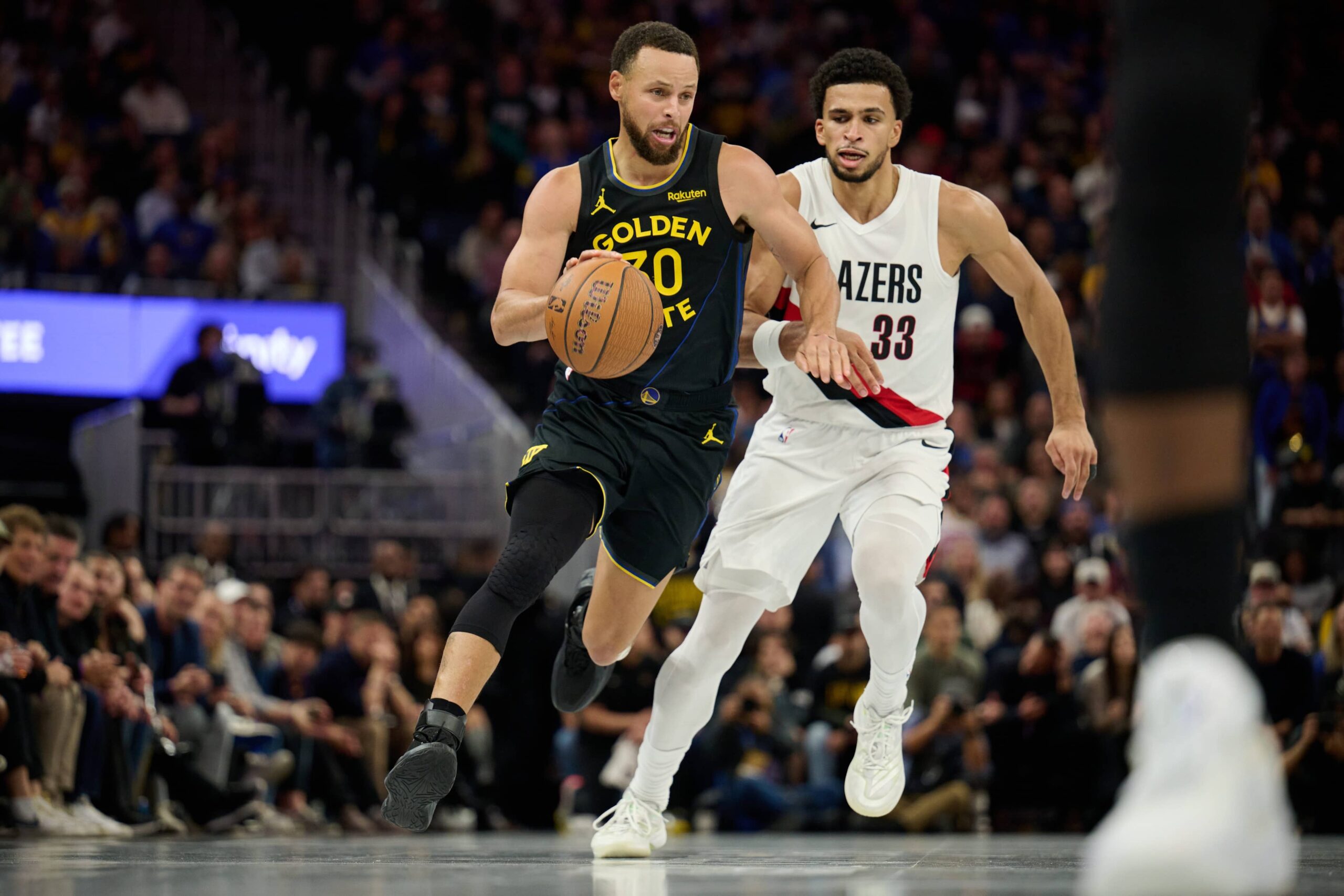 San Francisco, California, USA; Golden State Warriors guard Stephen Curry (30) drives to the basket against Portland Trail Blazers forward Toumani Camara (33) during the fourth quarter at Chase Center. Mandatory Credit: Robert Edwards-Imagn Images