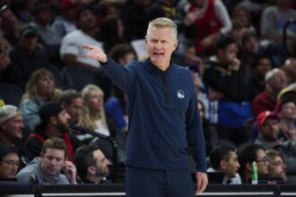 Portland, Oregon, USA; Golden State Warriors Head Coach Steve Kerr questions a referee during the first half against the Portland Trail Blazers at Moda Center. Mandatory Credit: Troy Wayrynen-Imagn Images