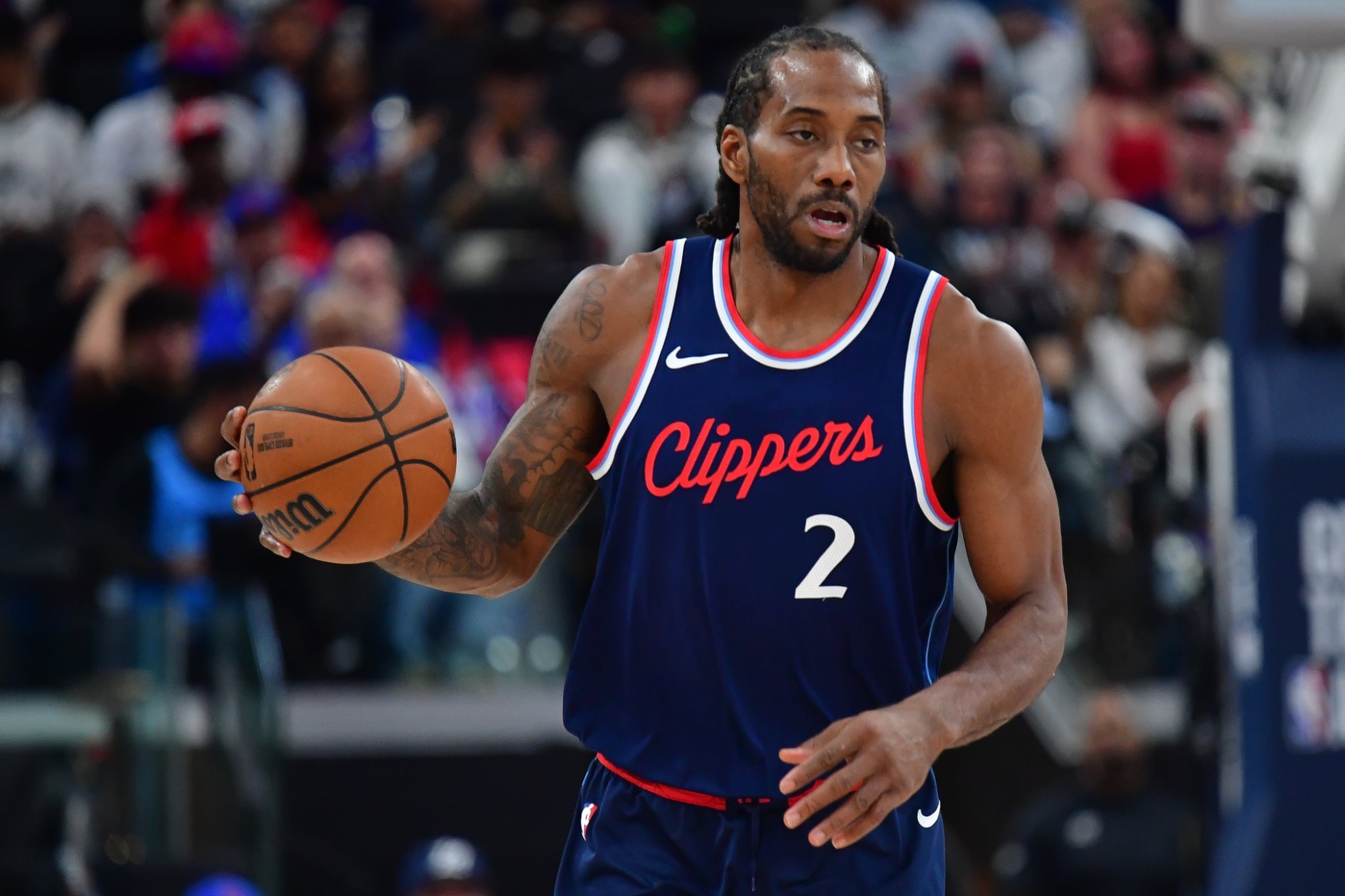 Apr 24, 2025; Inglewood, California, USA; Los Angeles Clippers forward Kawhi Leonard (2) moves the ball up court against the Denver Nuggets during the second half of game three in the first round for the 2024 NBA Playoffs at Intuit Dome. Mandatory Credit: Gary A. Vasquez-Imagn Images
