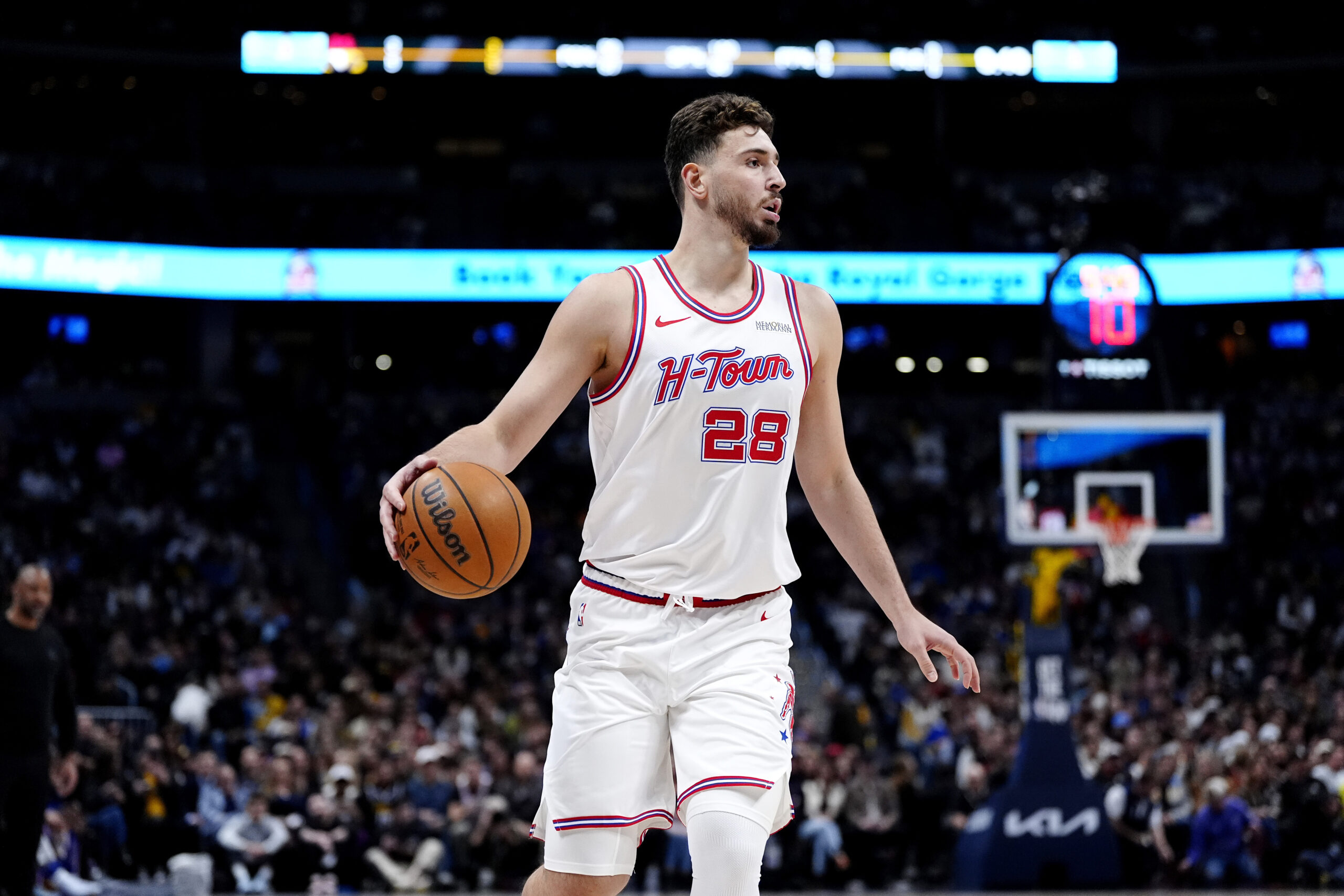 Dec 15, 2025; Denver, Colorado, USA; Houston Rockets center Alperen Sengun (28) controls the ball in the first quarter against the Denver Nuggets at Ball Arena. Mandatory Credit: Ron Chenoy-Imagn Images