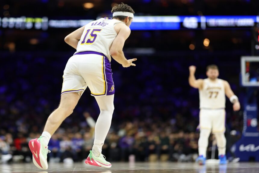 Dec 7, 2025; Philadelphia, Pennsylvania, USA; Los Angeles Lakers guard Austin Reaves (15) reacts to his three pointer against the Los Angeles Lakers during the second quarter at Xfinity Mobile Arena. Mandatory Credit: Bill Streicher-Imagn Images